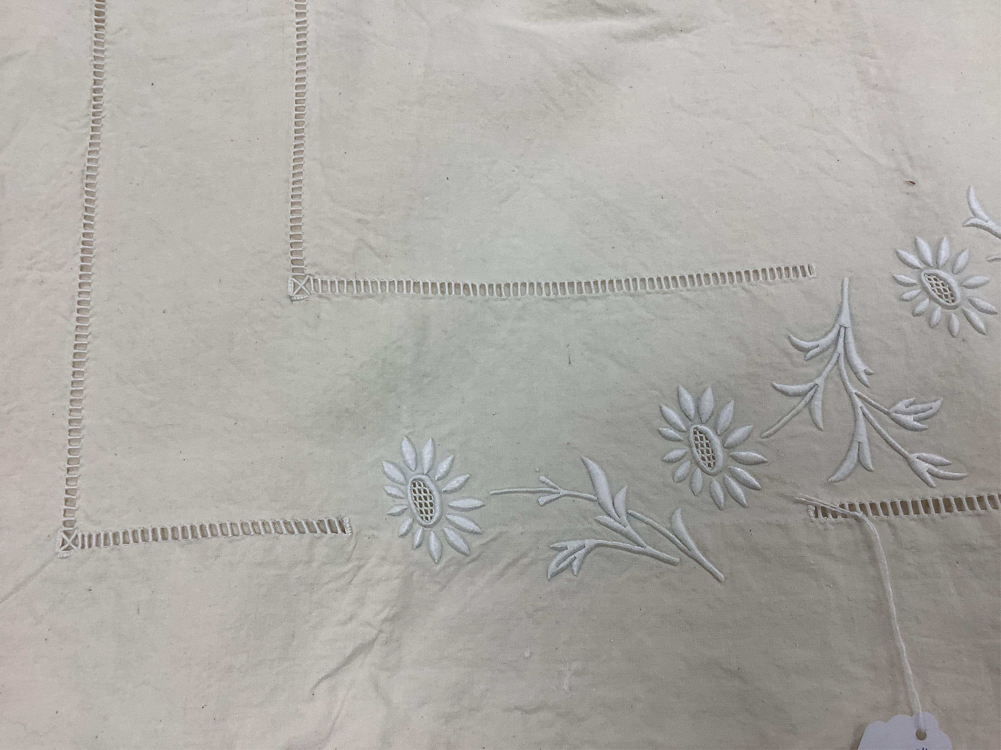 Four French provincial linen floral embroidered and drawn thread turn back, wide and long top sheets. Each sheet with different embroidery, dimensions and shades of linen, being ecru to off white. Condition - ecru sheet,
